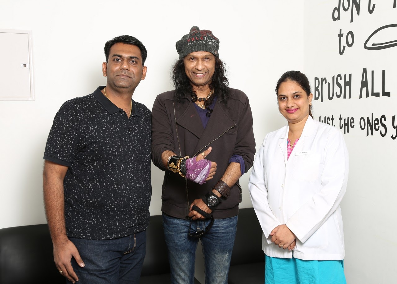 Dr. Manish and Dr. Ameya Sonawane with a visiting artist