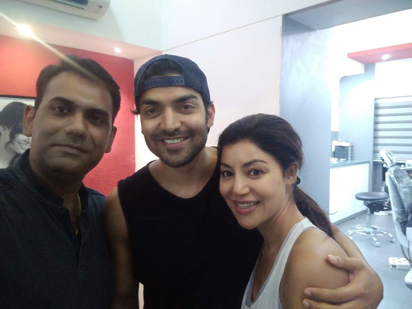 Dr. Manish Sonawane with visiting celebrity guests at the clinic